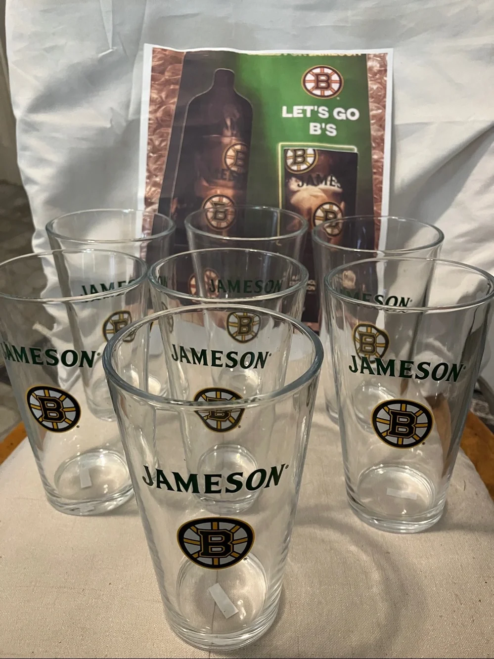 New. Set of 7 pint size glasses with Jameson - Boston Bruins logo on front